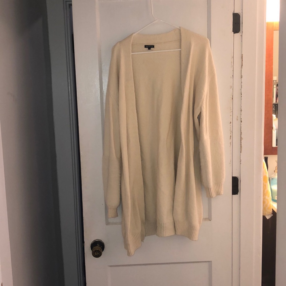 Long Cream Cardigan. Has fur sleeves.